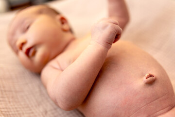 Newborn baby girl. Newborn baby close-up. Baby's navel.