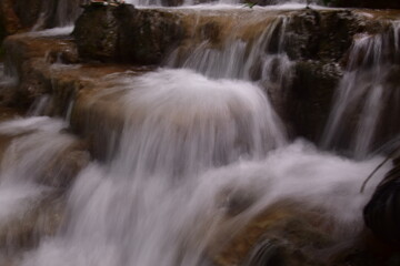 Travel to waterfalls during the rainy season, The tiers of the waterfall contrast beautifully with the sky