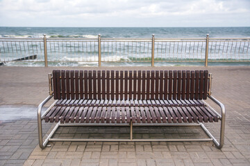 Brown bench  at the beach of Zelenogradsk ,Russia.