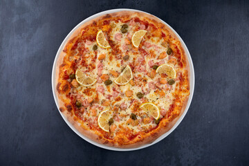 fresh pizza on the white plate