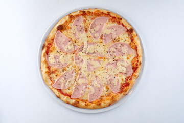 fresh pizza on the white plate