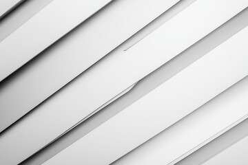 Fototapeta premium White background with a series of white lines. The lines are thin and appear to be cut off at the top. The image has a minimalist feel to it, with the white lines dominating the scene