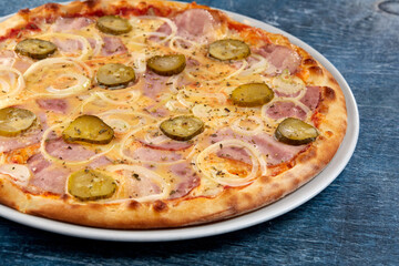 fresh pizza on the white plate