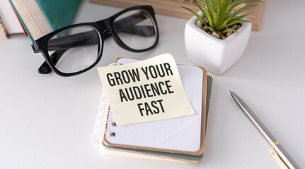 Grow Your Audience Fast text on notepad, business concept