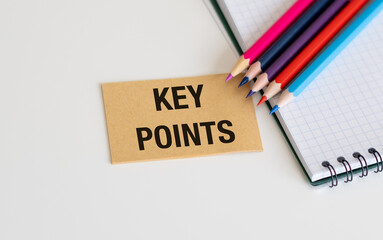 Key Points inscription on a card with colored pencils on a white background, business concept