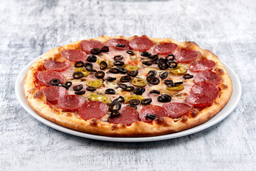 fresh pizza on the white plate
