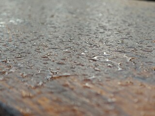 Water droplets on the surface of a concrete floor. Selective focus.