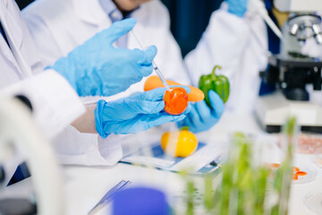 Dynamic scene of food scientists using microscopes and pipettes in a lab,