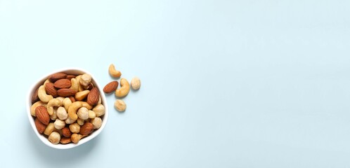 Mixed nuts on colored background