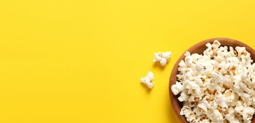 Delicious popcorn on color background 
