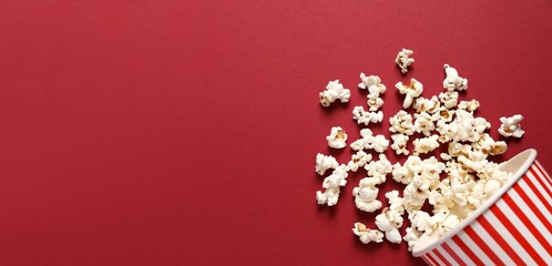 Delicious popcorn on color background 