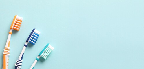Various toothbrushes on a colored background. Concept of tooth treatment and dental care