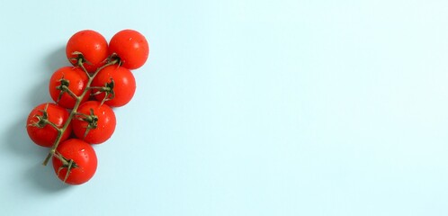 Flat lay composition with fresh cherry tomatoes on color background. Ripe vegetables