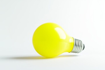 Illuminated yellow bulb against a white background