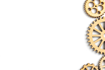 Wooden gear isolated on white background. empty space for copy space. concept of progress, workflow, automation, business process.