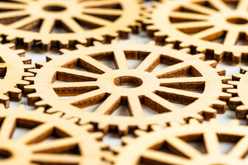 Fototapeta premium close up view of wooden gear on white background. concept of progress, workflow, automation, business process.