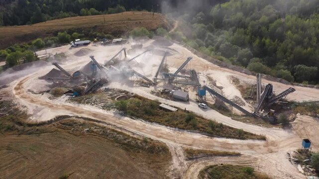  Aerial view of stone jaw crusher plant. Sand making plant and belt conveyor in mining quarry