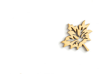 laser cut wooden leaf on white background. empty space for copy space.