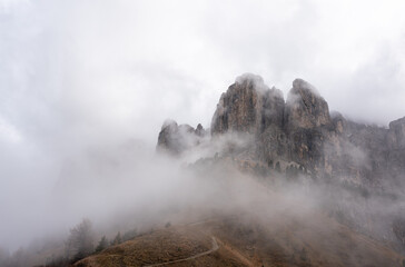 Hiking trail through clouds high in the Italian Dolomites