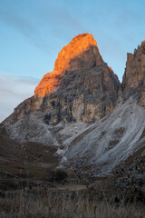 Sunrise alpenglow on the limestone peak of Sassolungo