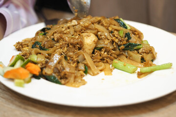 Kwetiaw goreng or fried kwetiaw. perfect for recipe, article, or any cooking contents.