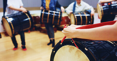 People, hands and drum in studio for music, rehearsal and traditional rhythm in Japan. Taiko,...