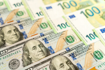 Money, Dollar and Euro. One hundred US dollar banknote over Euro banknotes. Foreign exchange market concept.