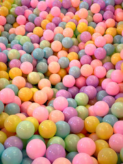 Pattern Dozens of bright pastel colored balls. Each ball is shiny and shiny. Photography background.