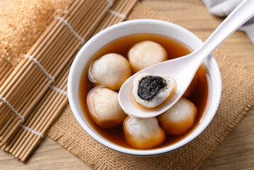 Tangyuan (Chinese sweet dumpling), Glutinous rice flour filling with black sesame in ginger syrup