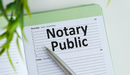 NOTARY PUBLIC text written on a sticky with pencil and glasses