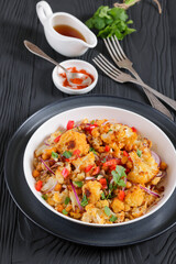 cauliflower chickpea quinoa salad in a white bowl