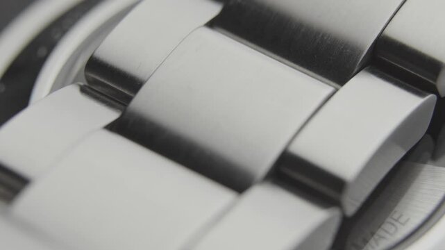 Macro close up of steel watch bracelet links
