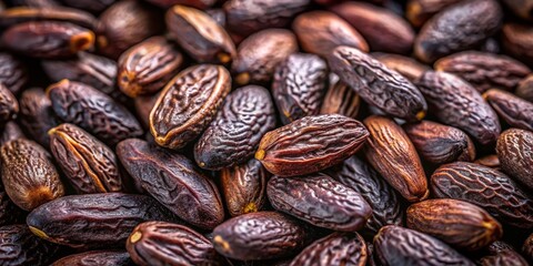 Obraz premium Aerial Close-Up of Tonka Beans Isolated, Highlighting Their Unique Texture and Color for Culinary and Aromatic Uses in Natural Health and Wellness Contexts