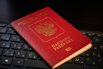 PASSPORT of Russian Federation on a black laptop keyboard. Identification of the user on the Internet. Prohibition of access to the Internet without passport data. issuing a passport via Internet