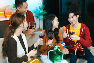 Dinner and group of people celebrating together at Merry Christmas and New Year.