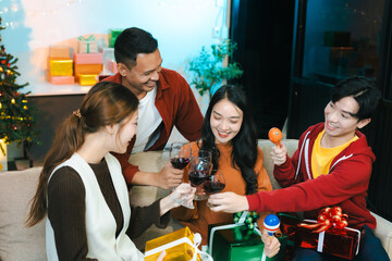 Dinner and group of people celebrating together at Merry Christmas and New Year.