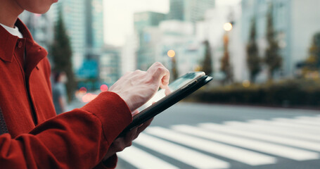 Typing, tablet and hands of Asian man in city for social networking, online chat and internet...