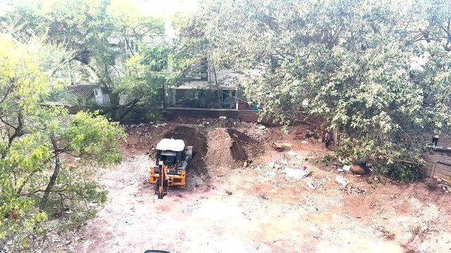 Jcb Excavator redistributing the material 