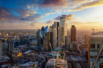 Elevated view of the City of London with the financial skyscrapers and Tower Bridge in the background during golden sunset time