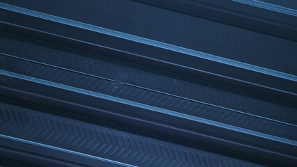 A sleek, metallic black backdrop, adorned with parallel lines, creates a futuristic aesthetic,...