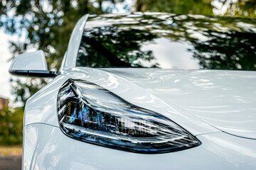 Car in the park. Car on the road. Car near the river and lake. Car against the backdrop the city.