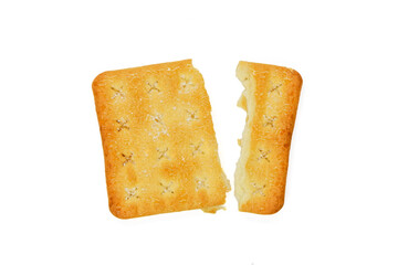 Cracker pieces isolated. Crumbled square biscuits. Sugar coated biscuits on white background