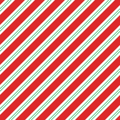 Naklejka premium Candy cane background. Diagonal stripes seamless pattern. Peppermint wrapping texture. Red candy cane stripes. Vector illustration