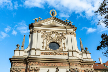 Facade of 17th century Baroque Church of St. Ignatius in Charles Square (in Czech Karlovo náměstí), New Town (Nove Mesto), Prague, Czechia