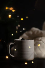 Steaming cup of coffee over a cityscape background