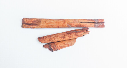 cinnamon stick spice isolated on white background closeup. Cinnamomum verum pieces for cooking