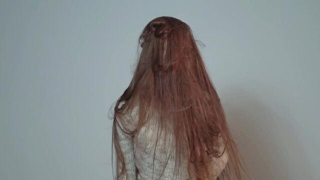 Natural long Hair of beauty woman. Very long brown hair. Long haired woman shaking his long hair. Girl with flying Hair. Portrait of pretty model with hairstyle.