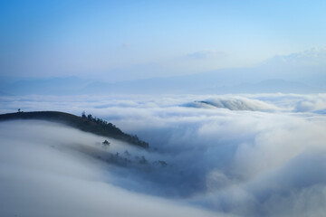 Beautiful scenery of the Po ku de viewpoint a sea of mist in the morning with the movement of the fog covering the Mountain. Tourism enjoy the natural beauty Mae Chaem, Chiang Mai, Thailand.