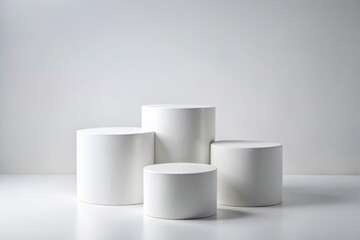 Minimalist Product Photography Featuring Three White Cylinder Podiums on a Clean White Background for Elegant Display and Advertising Purposes