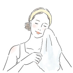 タオルで顔を拭いている若い女性の上半身
